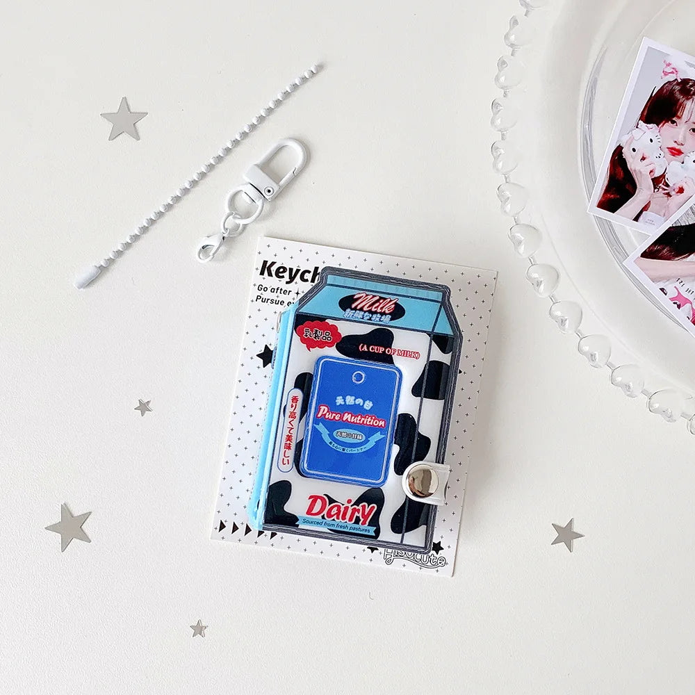 A photo keychain featuring a cartoon milk bottle design on a card with a silver keyring.