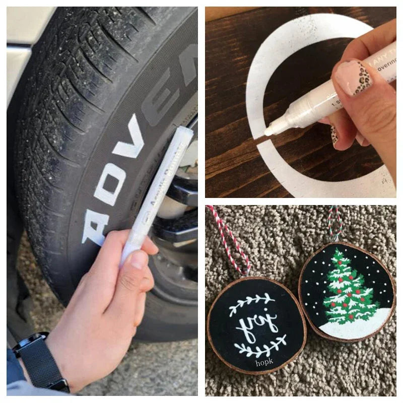 A hand holds an acrylic paint pen on a tire, next to a decorated Christmas tree ornament.