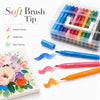 A clear plastic box of a 48-color acrylic paint marker set with brush tips next to an open palette.