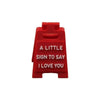 A red 3D printed letter sign ornament with the text A LITTLE SIGN TO SAY I LOVE YOU