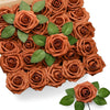 A dense arrangement of artificial real touch foam roses in various shades of brown and copper.