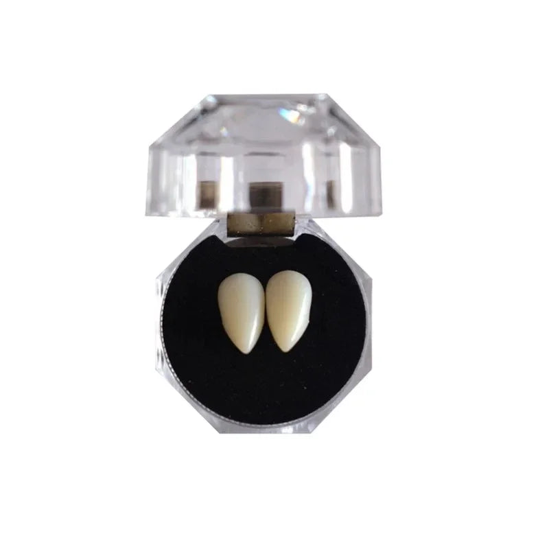 Realistic vampire fangs with an adjustable fit displayed in a clear plastic holder.