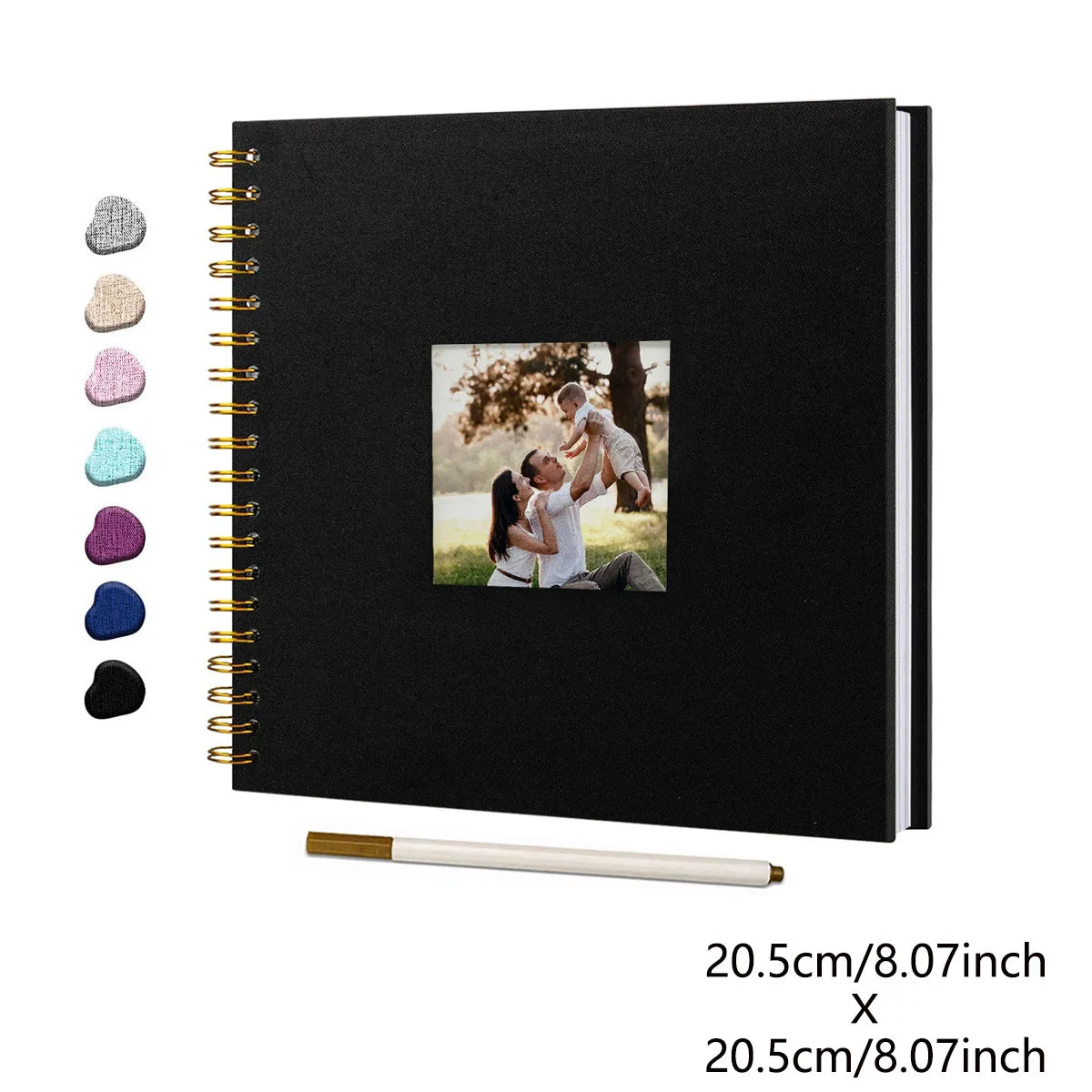 Black linen cover scrapbook album with a gold spiral binding and a photo of a couple.