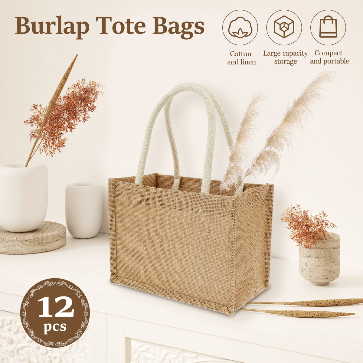 A beige burlap tote bag with cotton rope handles is displayed next to dried floral elements.