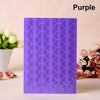 Purple PVC photo corner protectors with a geometric pattern displayed next to white flowers.