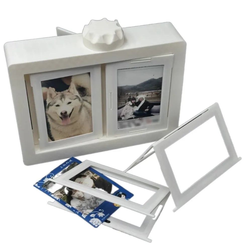A white 3D rotating photo holder with twelve clear display pockets and a separate frame.