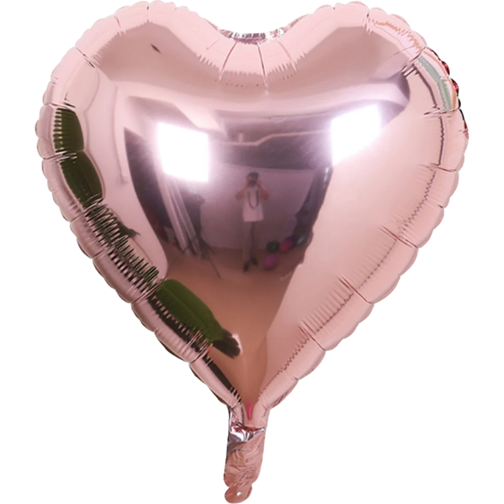 A heart-shaped foil balloon featuring a star design, filled with air.