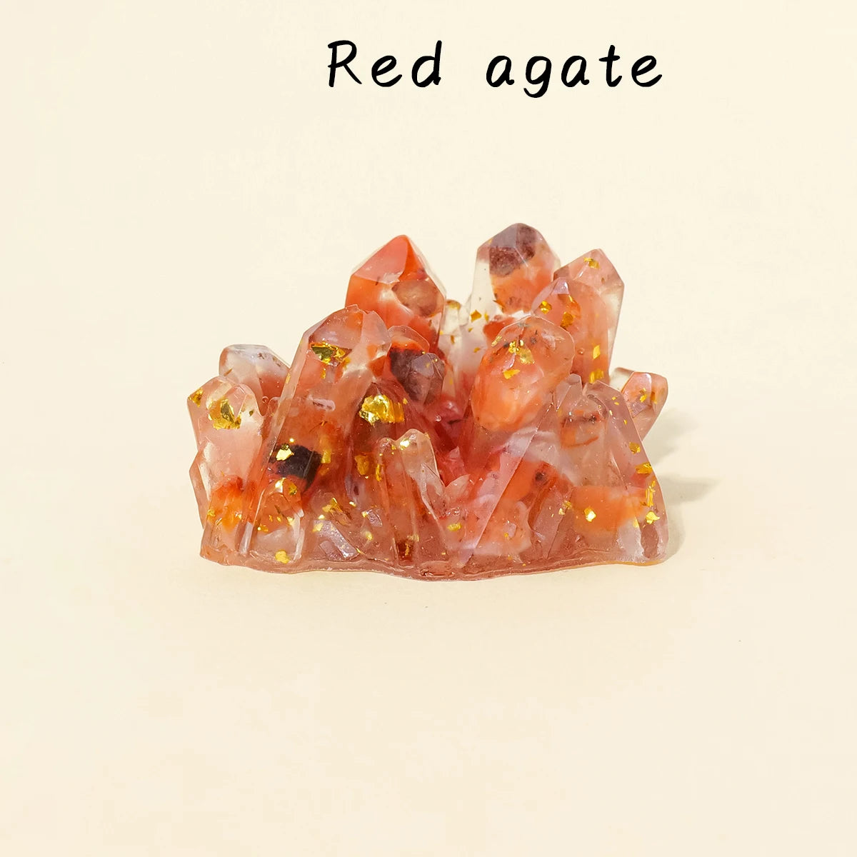 A cluster of reddish-pink agate crystals with gold inclusions.
