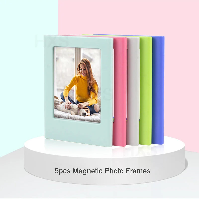 Five colorful magnetic photo frames standing upright on a white circular base