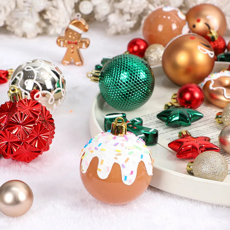 A collection of shiny Christmas ball ornaments in gold, red, and green tones scattered on a white surface.
