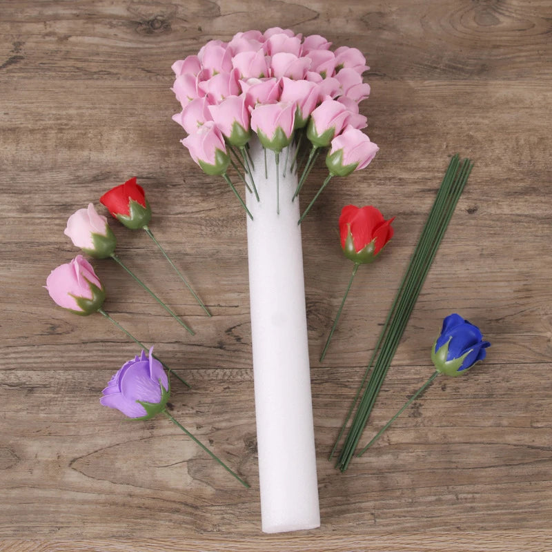 A white foam flower arrangement cylinder featuring pink, red, and blue roses.