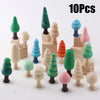 A set of ten wooden Christmas tree ornaments in various shades of green, pink, and orange.