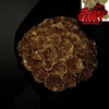 A pile of gold glitter artificial roses used for DIY crafts and gifting.