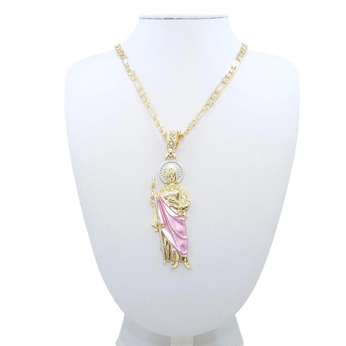 A gold-plated pendant necklace featuring a figure of Saint Jude on a white display bust.
