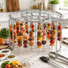 Stainless steel vertical skewer rack holding various colorful food items for grilling or air frying