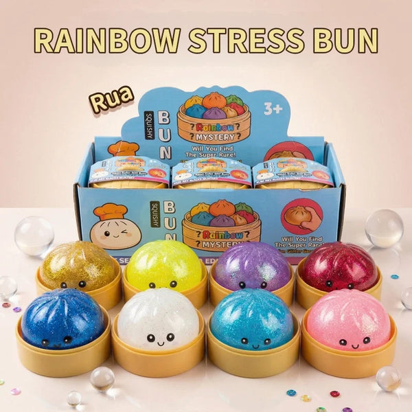A box of Rainbow Stress Bun squishy toys featuring various colored and textured balls.