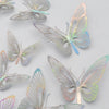 A collection of metallic gold and silver butterfly cake toppers.