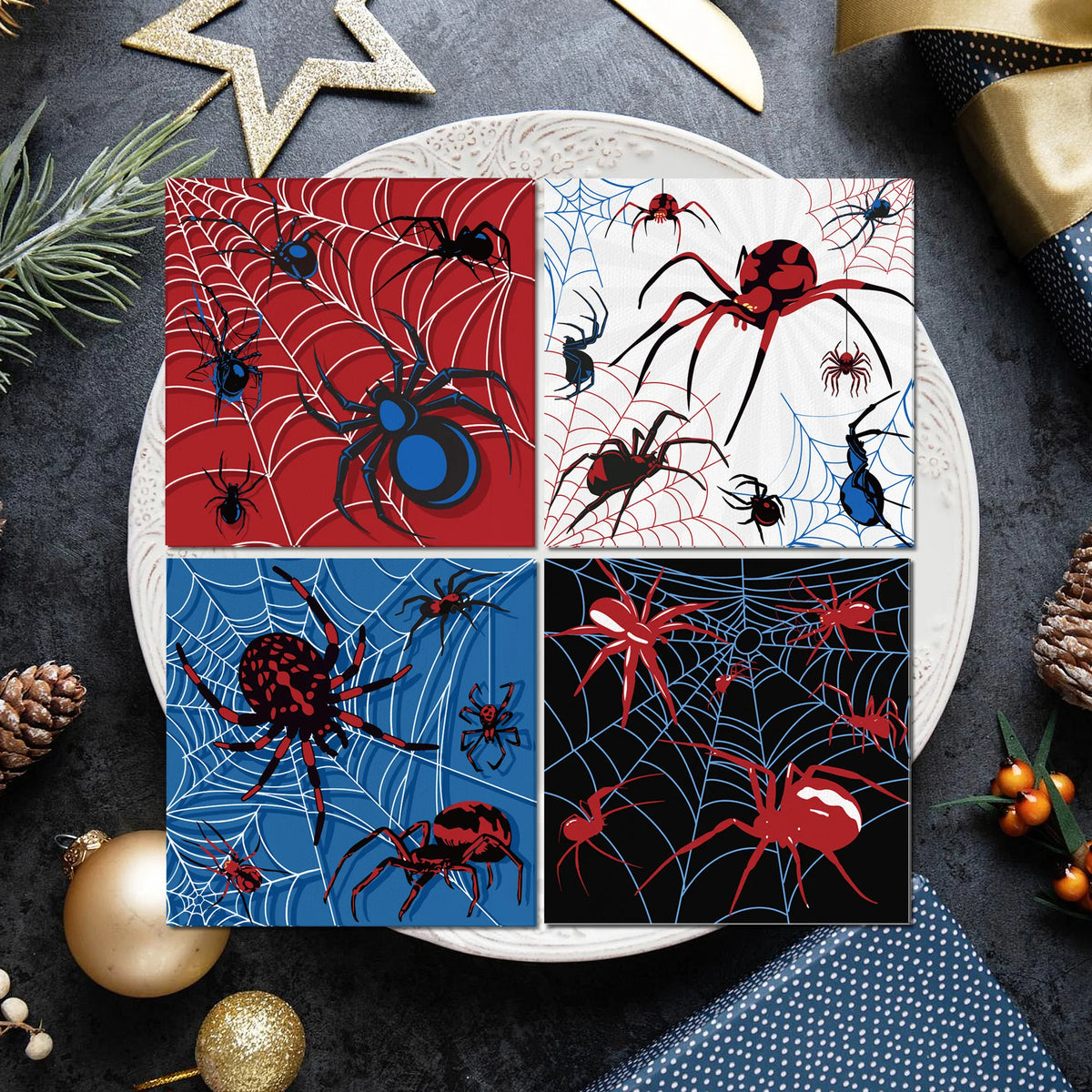 A set of four square paper napkins featuring red and blue Halloween spiders and webs on a white plate.