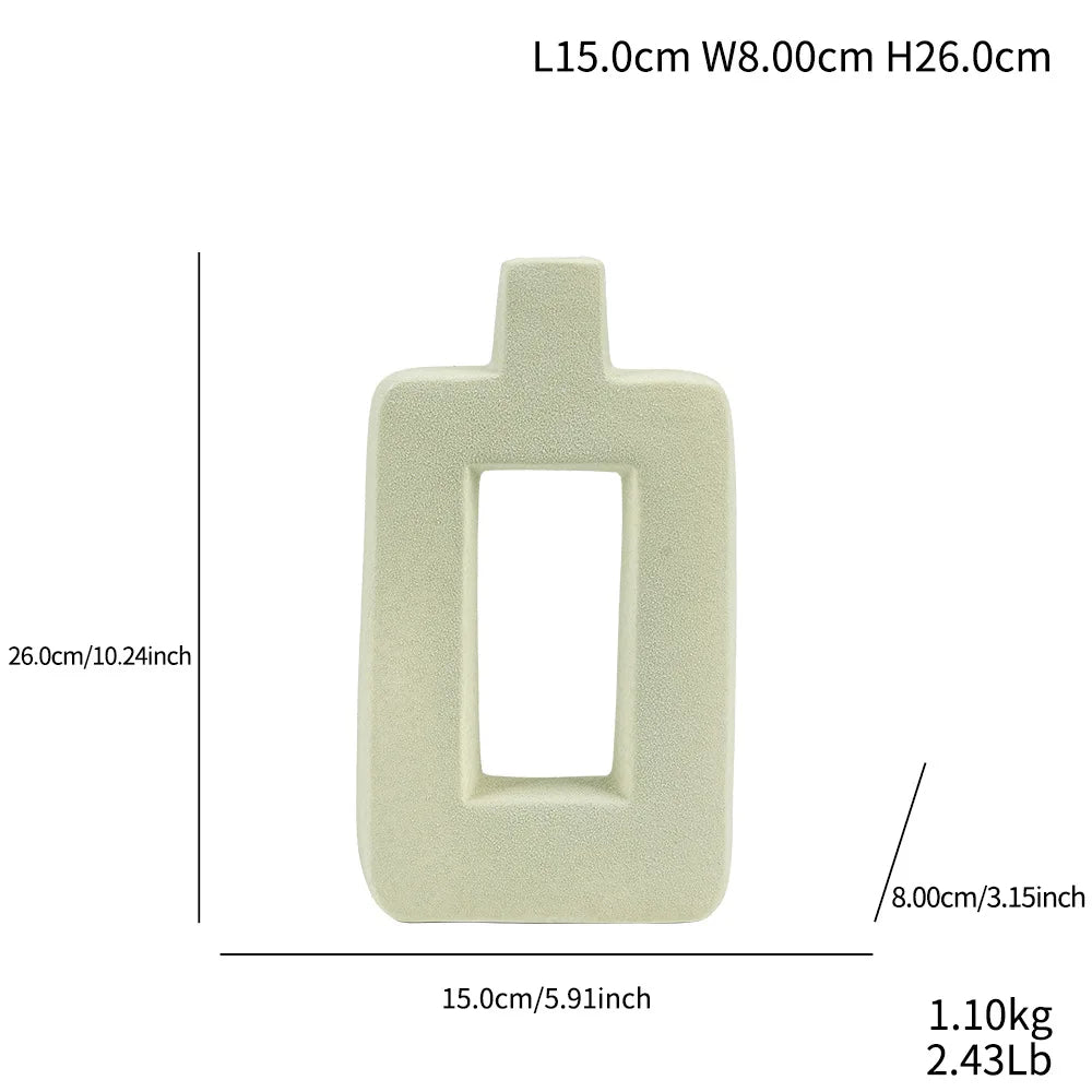 A light beige ceramic geometric vase with a rectangular opening, measuring 15.0cm wide by 26.0cm high.