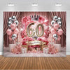 A pink and gold balloon backdrop for a 60th birthday photo booth featuring roses, balloons, and a crown.