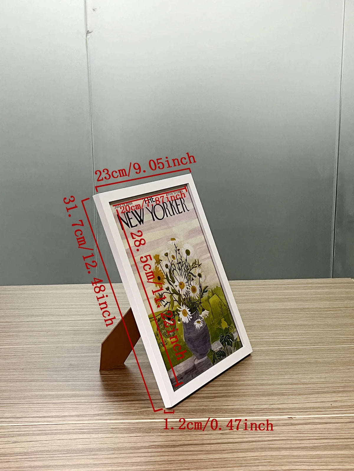 A set of three A4 solid wood picture frames with acrylic fronts displayed on a wooden surface.