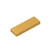 A rectangular building brick tile in a golden yellow color shown at an angle.