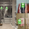 A display of hanging moisture absorber bags for closets and wardrobes in a modern retail setting.