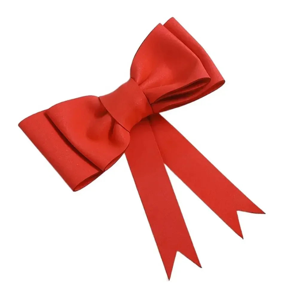 Topper de gâteau en nœud décoratif en mousse rouge vif.