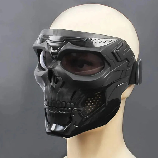 A black skull full face motorcycle and bicycle mask with a windproof lens displayed on a mannequin head.