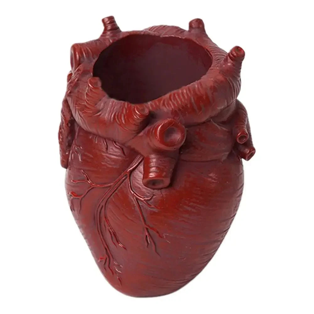 A reddish-brown resin heart-shaped pen organizer with detailed root-like texture.