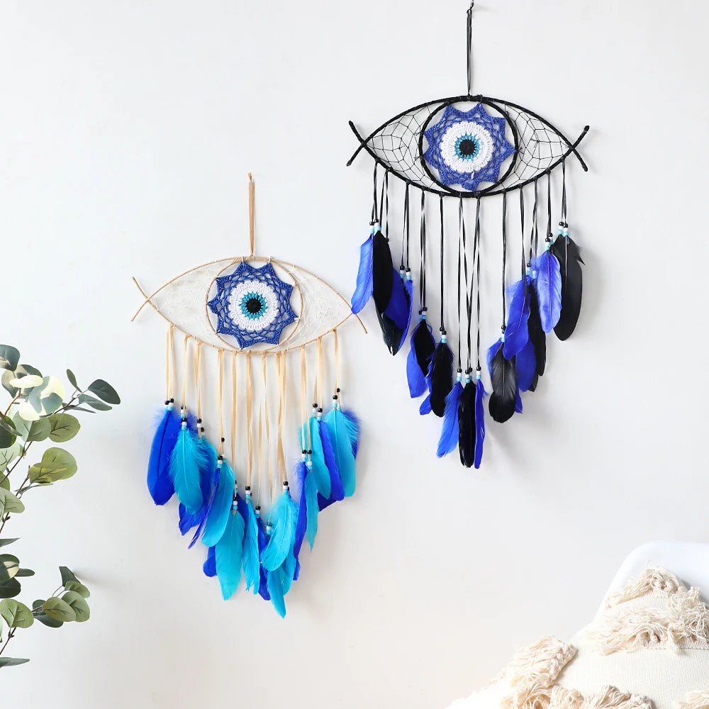 Handmade boho evil eye dream catcher wall decor featuring a blue and white eye with dangling feathers