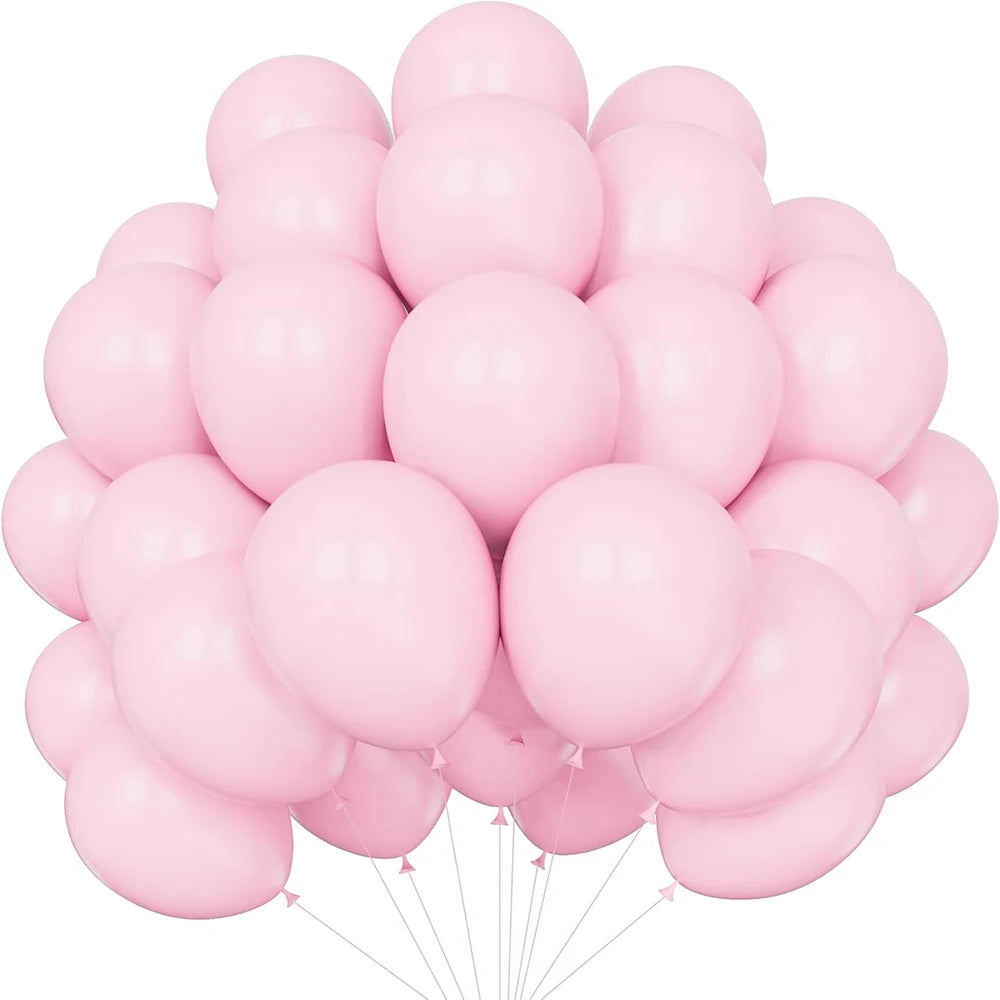 A bunch of pastel pink latex balloons tied together, ready for a party.