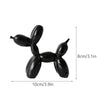 Black resin sculpture of a dog made from balloon shapes for modern home decor