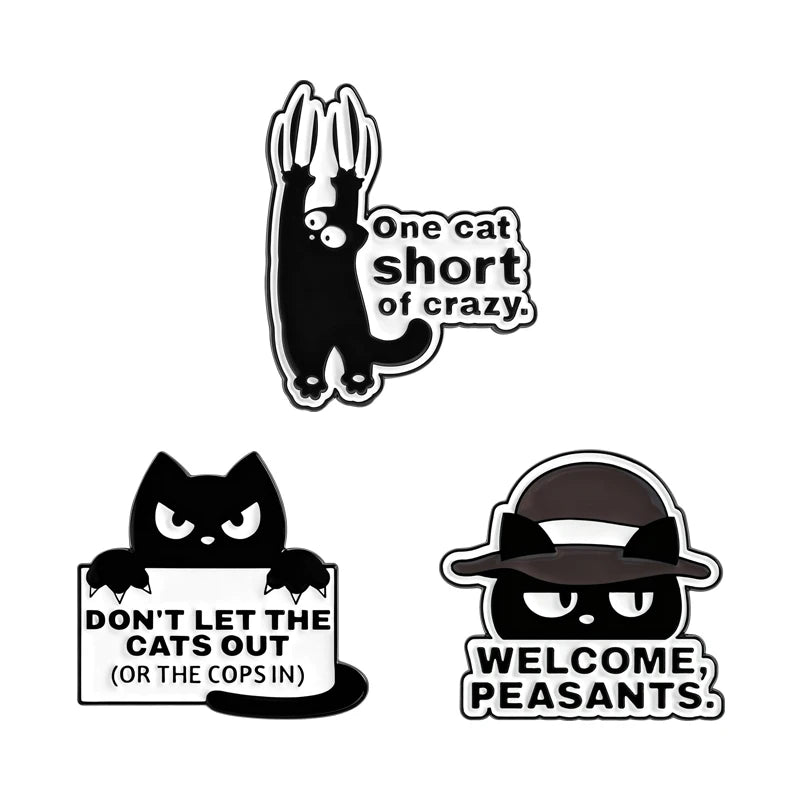 A set of cartoon cat enamel pins featuring a rude middle finger and daisy flower designs.