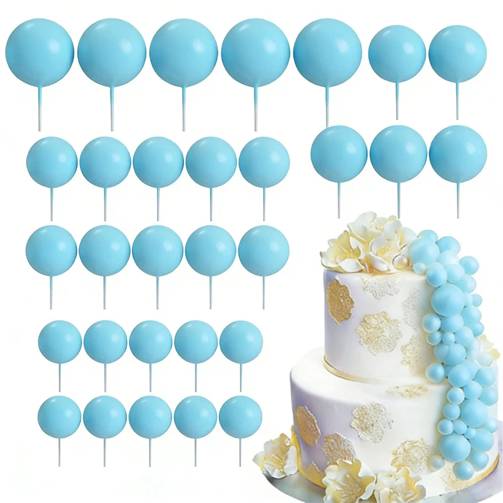 A set of light blue foam cake toppers on sticks for decoration.