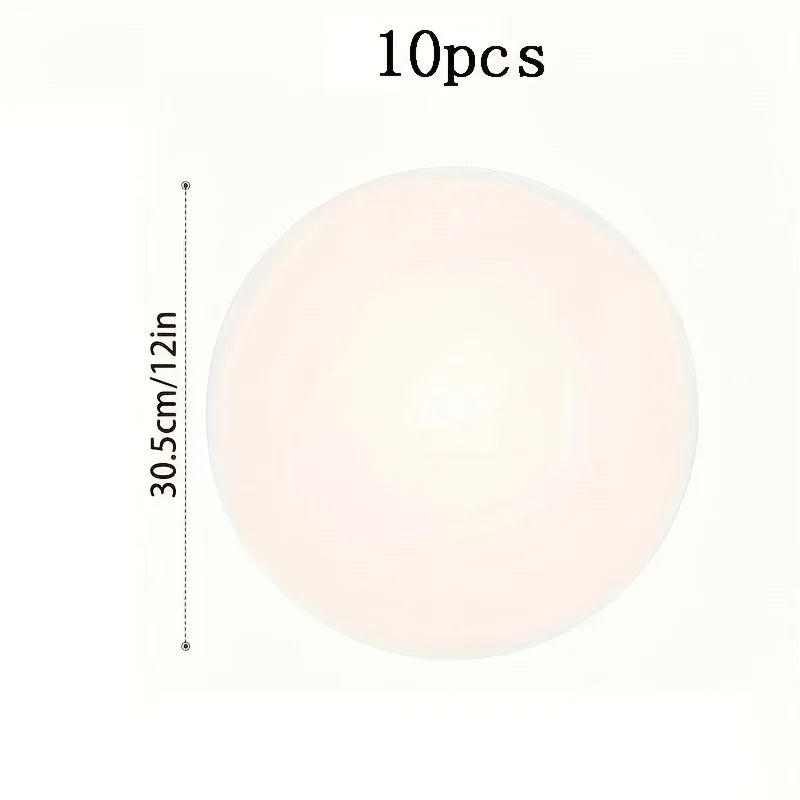 A set of 10 round cake boards with a white, translucent finish.
