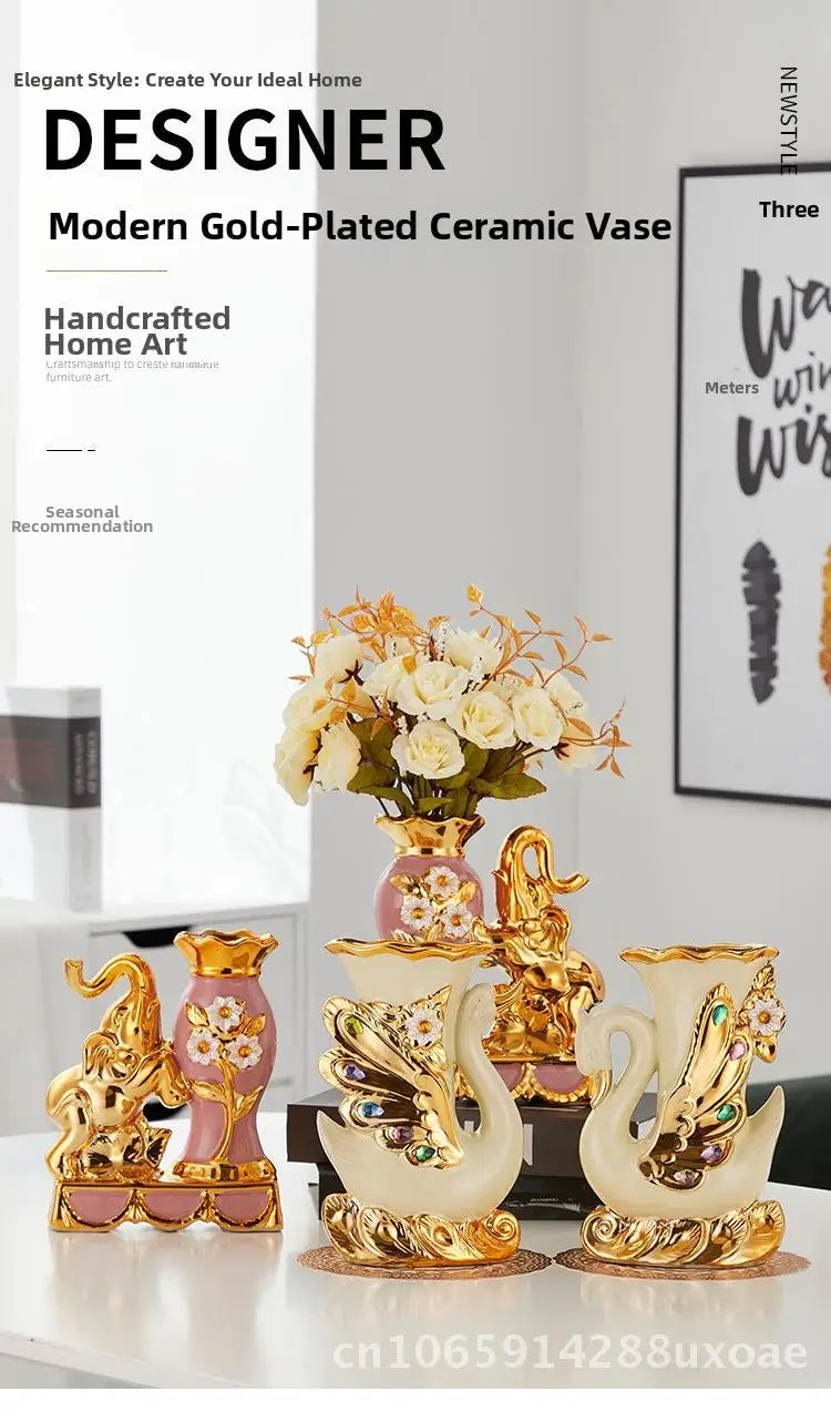 A pair of gold-plated ceramic swan vases displayed on a white surface with floral arrangements.