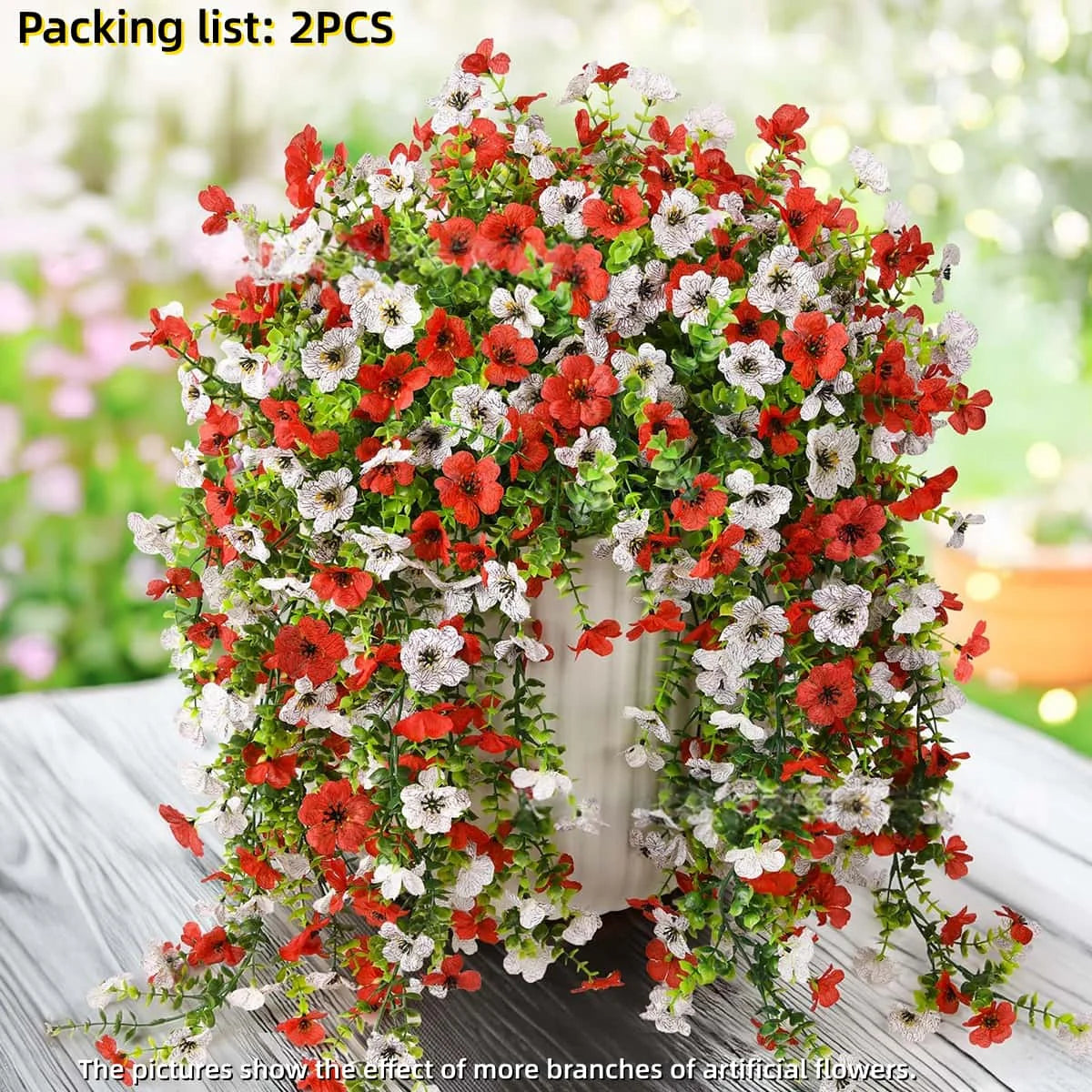 A dense arrangement of red and white faux silk flowers used for outdoor decor.