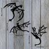 Set of three black dragon metal wall art panels with various sizes and wing designs