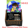 A wooden music box featuring an illustration of a Detective Conan character under an umbrella.