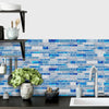 Blue and white marble tile wall sticker covering a kitchen or bathroom wall.