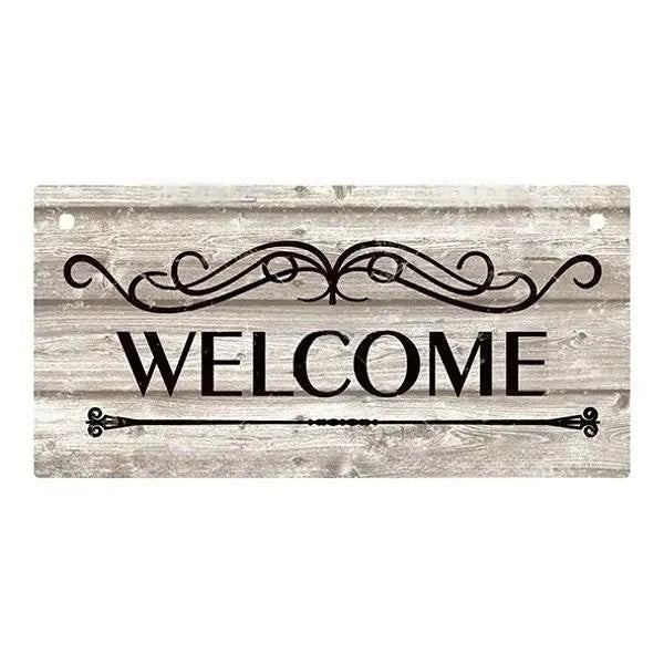 Rustic wooden hanging sign with the word WELCOME carved in elegant script on a weathered wood background.