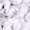 A close-up view of white silk rose petals for weddings and events.
