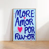 A vertical canvas print featuring the hand-painted text MORE AMOR POR FAVOR in blue and pink on a white background.