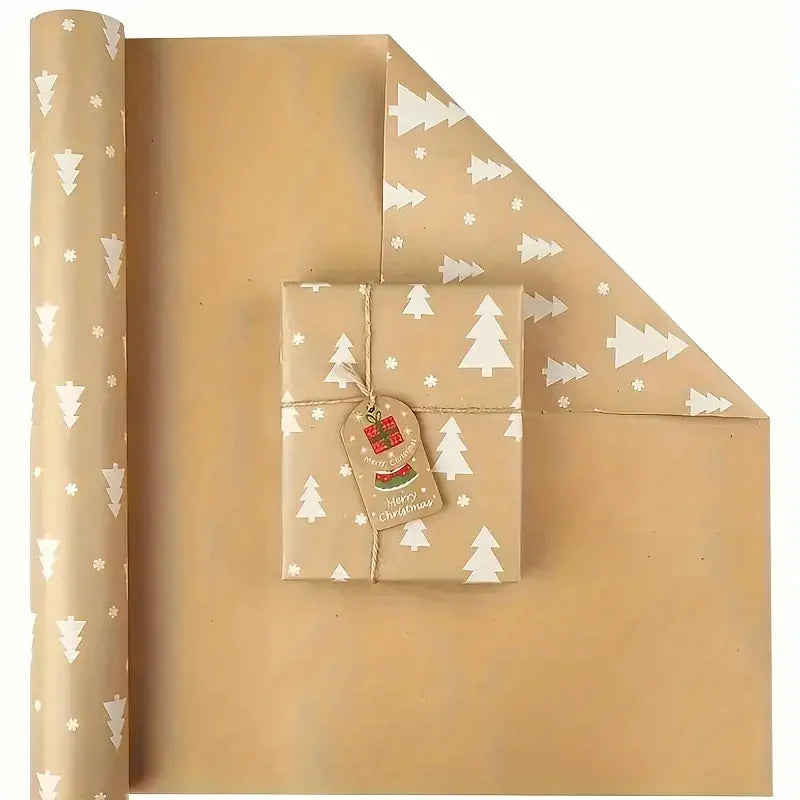 A roll of festive snowflake Christmas wrapping paper with a folded gift box displayed on the paper.