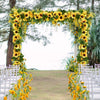 A floral archway decorated with yellow sunflowers and greenery for a wedding ceremony backdrop.