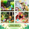 A collection of colorful resin animal figurines, including frogs, birds, and other creatures, displayed in various natural an