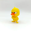 A yellow 3D printed statue of an angry duck with glaring eyes and an orange beak.