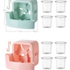 A portable ice-cooling floor fan in mint green and pink, shown with multiple clear cups.