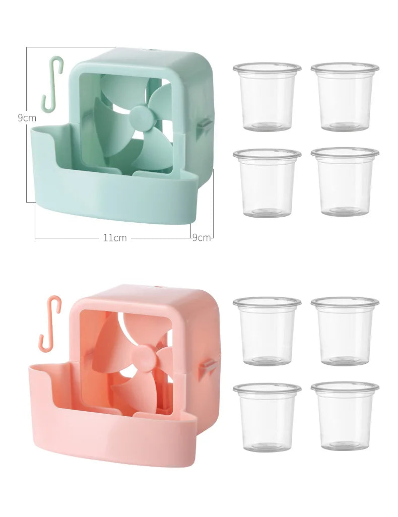 A portable ice-cooling floor fan in mint green and pink, shown with multiple clear cups.